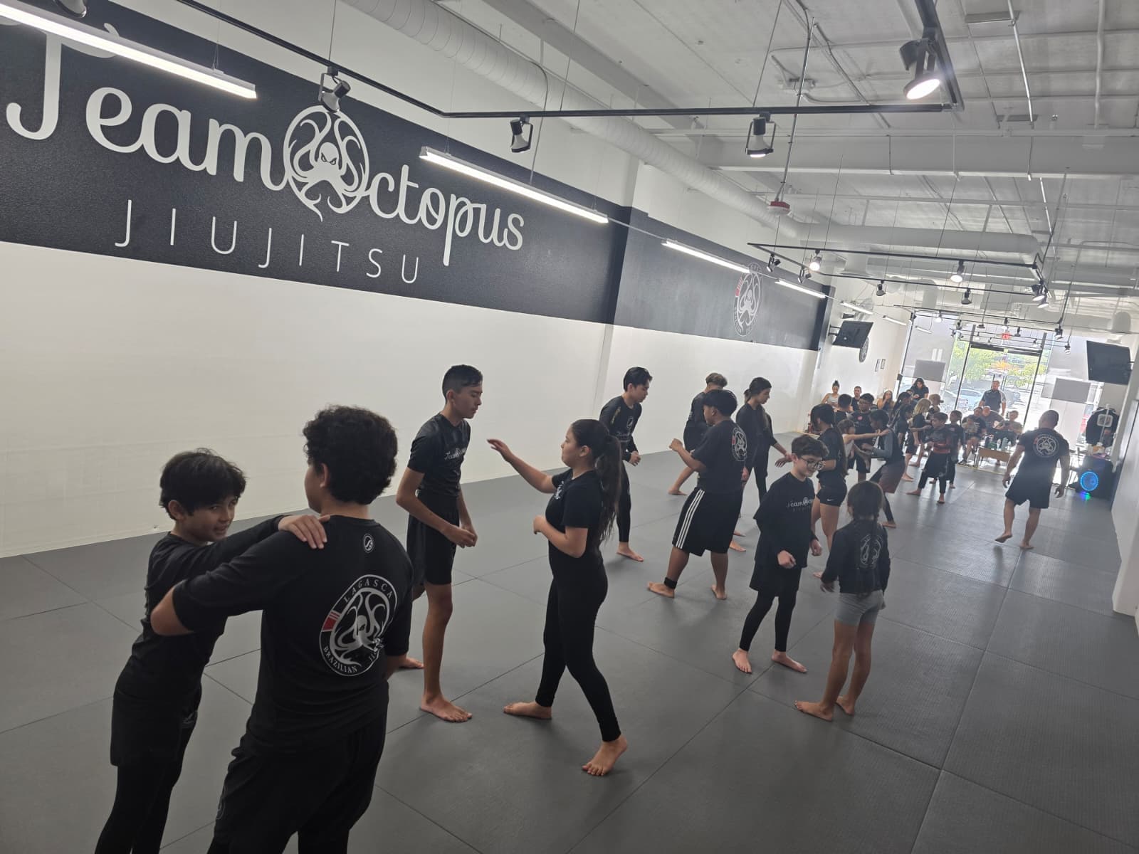 Team Octopus students training together on the mats